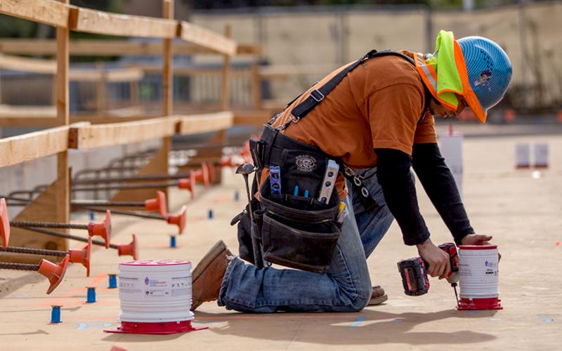 Construction working using HoldRite product on site.