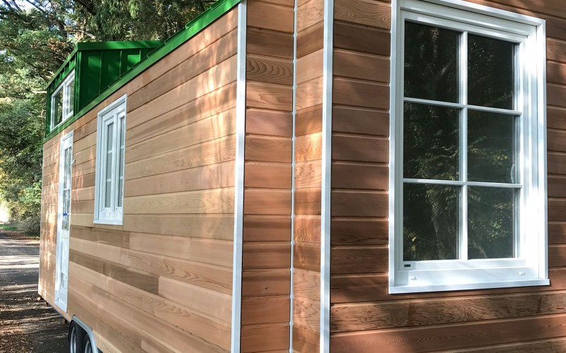 Exterior shot of a Tiny House with a green roof