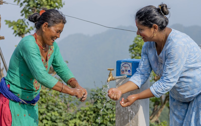 Nepali women getting water from a tap