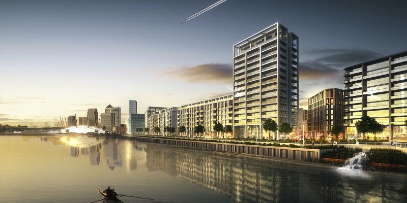 riverside view of apartment blocks along rivers edge at sunset